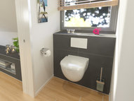 Wall-mounted WC clad with Qboard construction boards and tiles